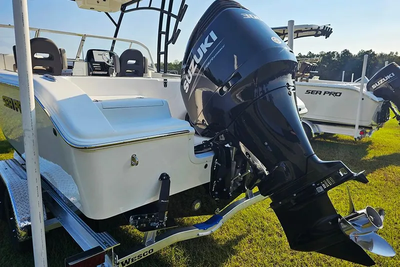 Slide: The Image of 2026 Sea Pro 240 Dual Console Sport boat with Suzuki outboard motor on trailer. - 10