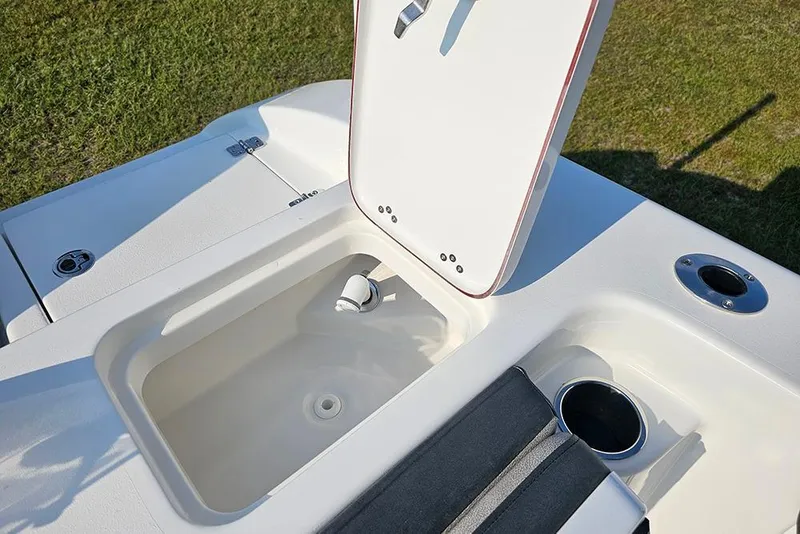Slide: The Image of 2026 Sea Pro 240 Dual Console Sport boat with open storage compartment. - 14