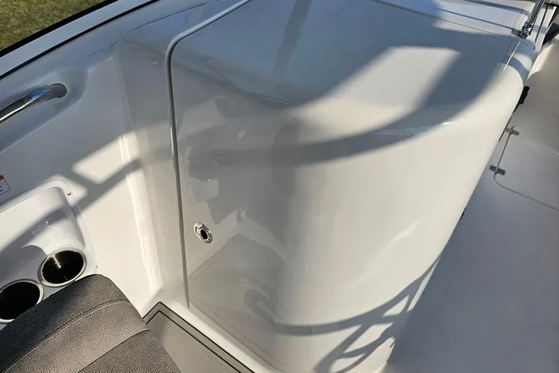 Slide: The Image of 2026 Sea Pro 240 Dual Console Sport boat interior with cup holders and seating. - 20