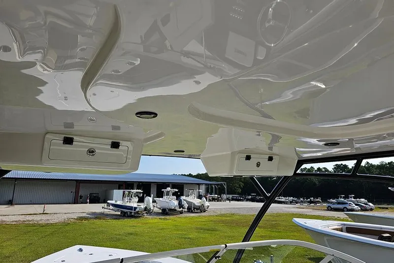 Slide: The Image of 2026 Sea Pro 240 Dual Console Sport boat interior with sleek design and storage compartments. - 26