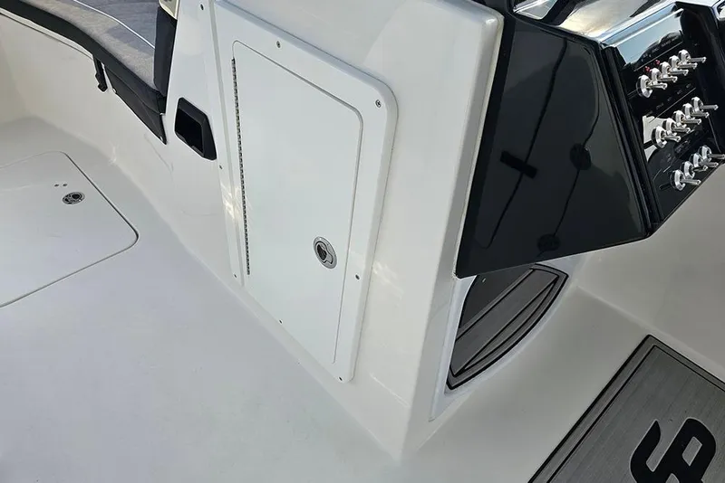 Slide: The Image of 2026 Sea Pro 240 Dual Console Sport interior with control panel and seating area. - 28
