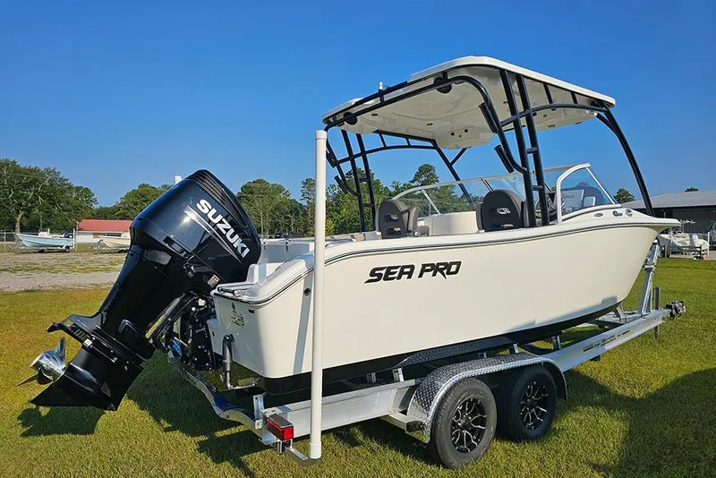 Slide: The Image of 2026 Sea Pro 240 Dual Console Sport boat on trailer with Suzuki outboard motor. - 3