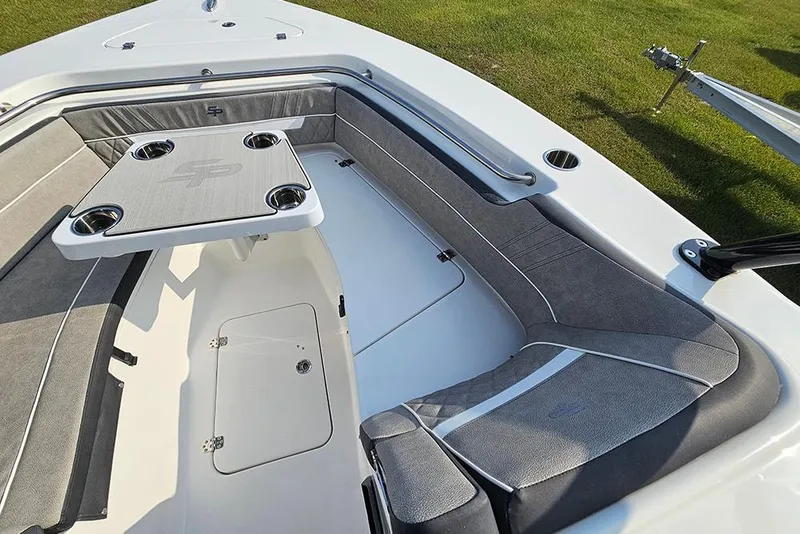 Slide: The Image of 2026 Sea Pro 240 Dual Console Sport boat interior with seating and table. - 33