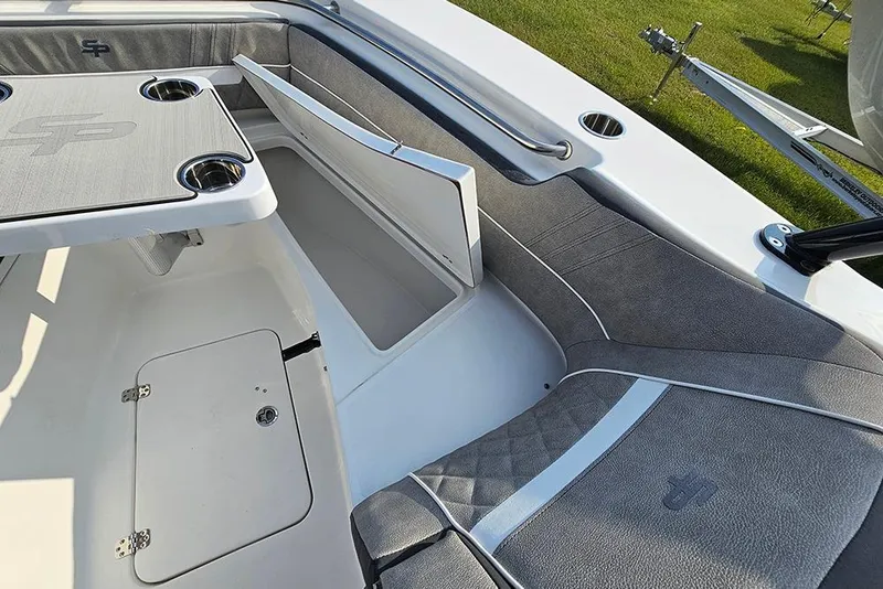 Slide: The Image of 2026 Sea Pro 240 Dual Console Sport boat interior with seating and storage. - 34