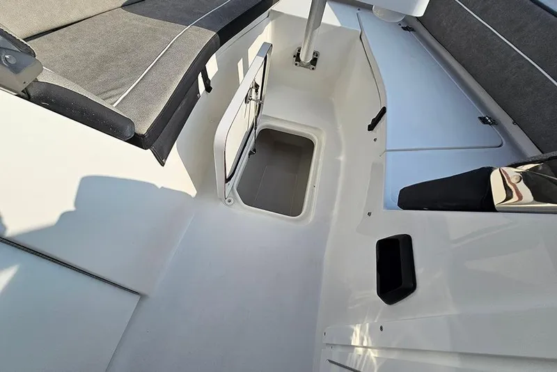 Slide: The Image of 2026 Sea Pro 240 Dual Console Sport boat interior with open storage compartment. - 35