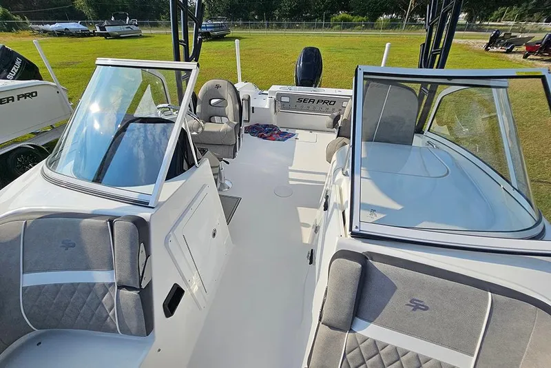 Slide: The Image of 2026 Sea Pro 240 Dual Console Sport boat interior with seating and windshield. - 36
