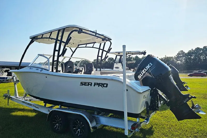 Slide: The Image of 2026 Sea Pro 240 Dual Console Sport boat on trailer with Suzuki outboard motor. - 7