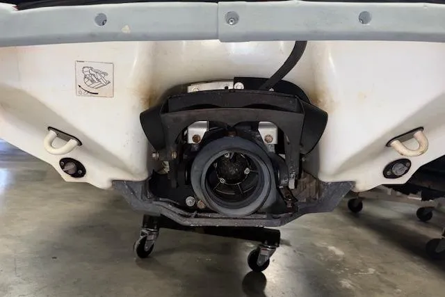 Slide: The Image of 2005 Yamaha WaveRunner VX 110 Deluxe jet propulsion system close-up in a garage. - 10