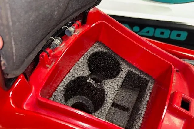 Slide: The Image of Open storage compartment of 2005 Yamaha WaveRunner VX 110 Deluxe with cup holders. - 12