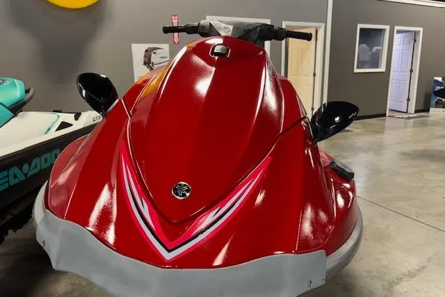 Slide: The Image of 2005 Yamaha WaveRunner VX 110 Deluxe in showroom, red color, front view. - 2
