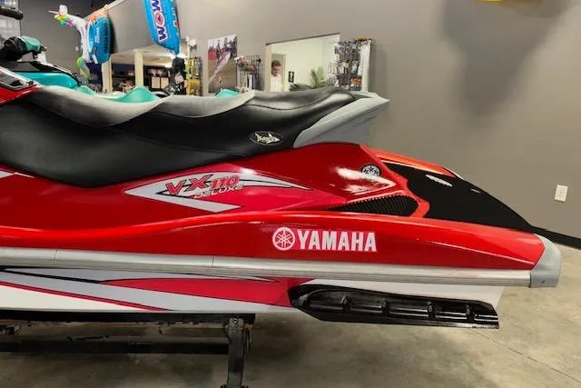 Slide: The Image of 2005 Yamaha WaveRunner VX 110 Deluxe in showroom, red and black design. - 5