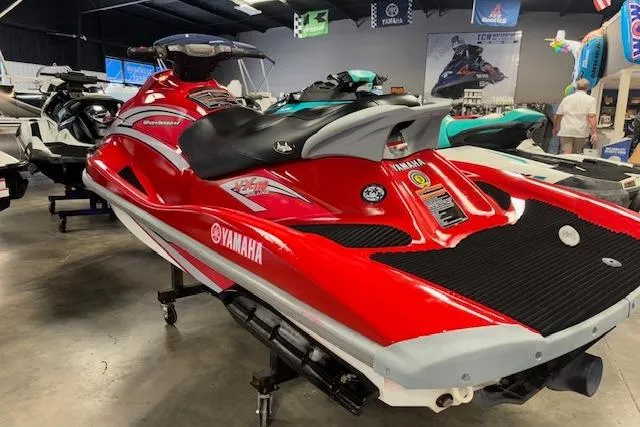 Slide: The Image of Red 2005 Yamaha WaveRunner VX 110 Deluxe jet ski displayed in showroom. - 6