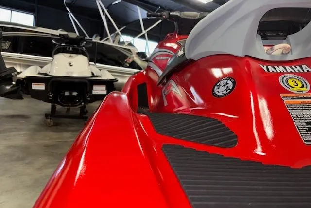 Slide: The Image of 2005 Yamaha WaveRunner VX 110 Deluxe in showroom, red color, close-up view. - 8
