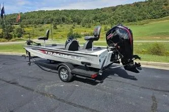 Slide: The Image of 2025 Tracker Pro Team 190 TX Tournament Edition boat on trailer, parked outdoors. - 3