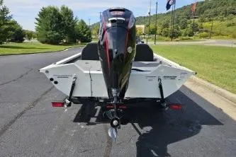 Slide: The Image of 2025 Tracker Pro Team 190 TX Tournament Edition boat on trailer, parked outdoors. - 4