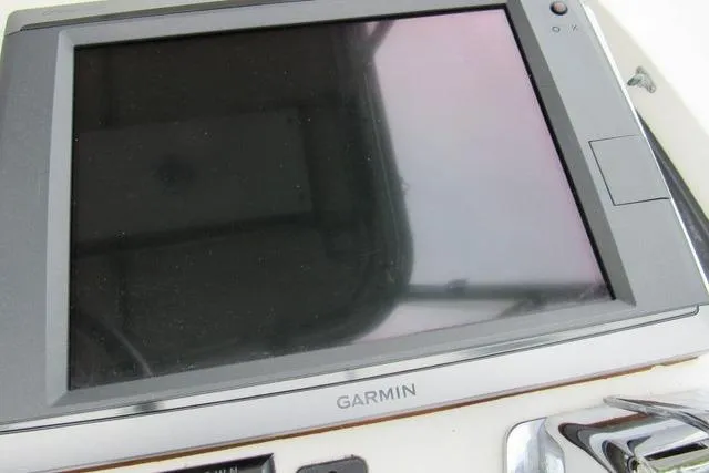 Slide: The Image of Garmin navigation system on 1989 Blackfin 27 Fisherman boat dashboard. - 6