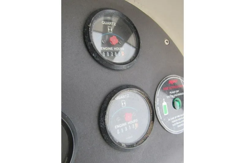 Slide: The Image of Close-up of engine hour meters on 1989 Blackfin 27 Fisherman boat dashboard. - 8