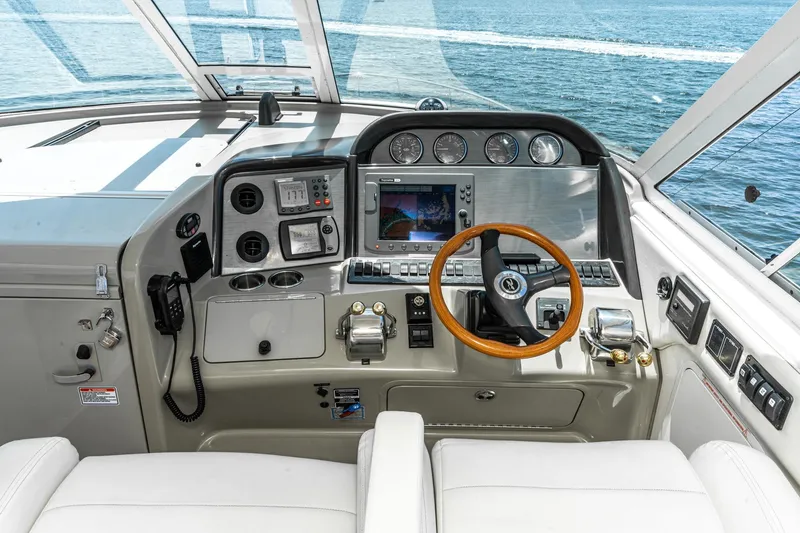 Slide: The Image of 2005 Sea Ray 390 Motor Yacht helm with navigation instruments and ocean view. - 17