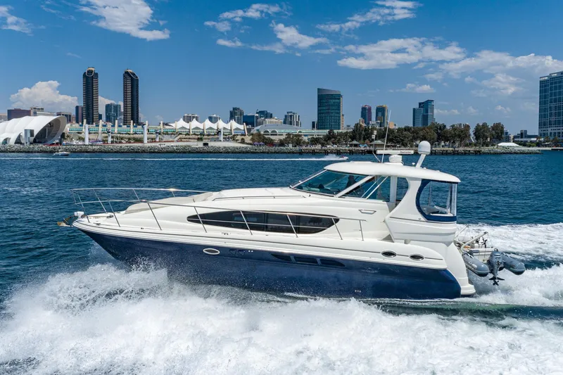 Slide: The Image of 2005 Sea Ray 390 Motor Yacht cruising in urban waterfront setting. - 2