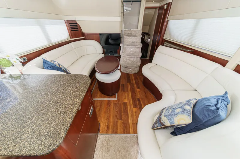 Slide: The Image of Luxurious interior of 2005 Sea Ray 390 Motor Yacht with elegant seating and modern decor. - 22