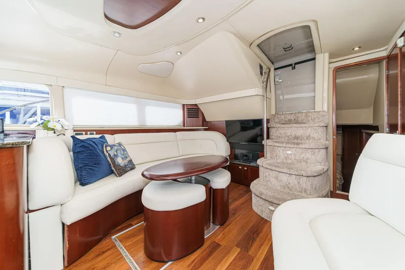 Slide: The Image of Luxurious interior of 2005 Sea Ray 390 Motor Yacht with elegant seating and wooden flooring. - 23