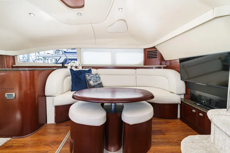 Slide: The Image of Luxurious interior of 2005 Sea Ray 390 Motor Yacht with elegant seating and modern amenities. - 24
