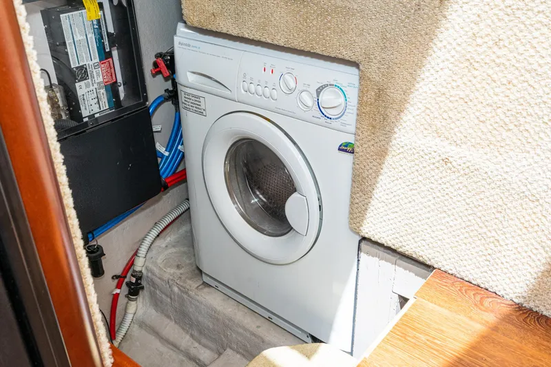 Slide: The Image of Washer in 2005 Sea Ray 390 Motor Yacht laundry area. - 29