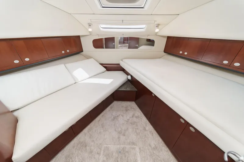 Slide: The Image of Luxurious interior of 2005 Sea Ray 390 Motor Yacht with elegant wood cabinetry. - 30