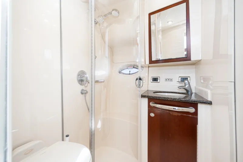Slide: The Image of 2005 Sea Ray 390 Motor Yacht bathroom with shower, sink, and mirror. - 32