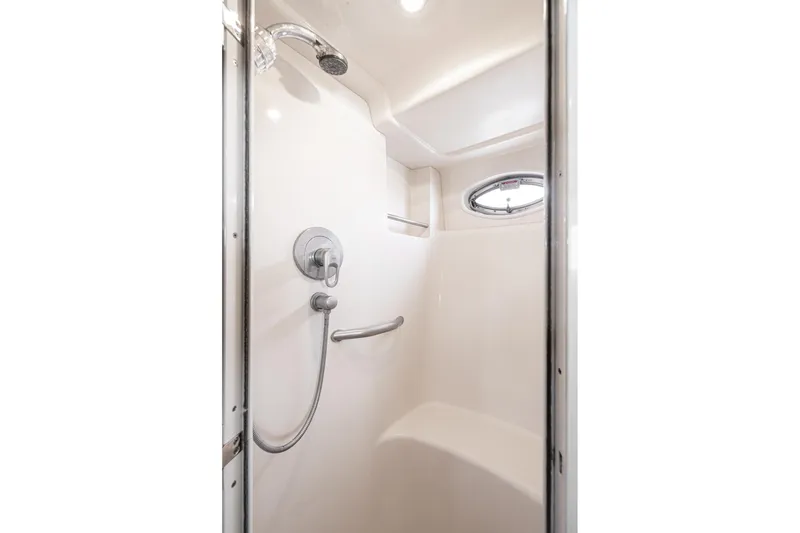 Slide: The Image of Shower area in 2005 Sea Ray 390 Motor Yacht with modern fixtures and porthole window. - 38