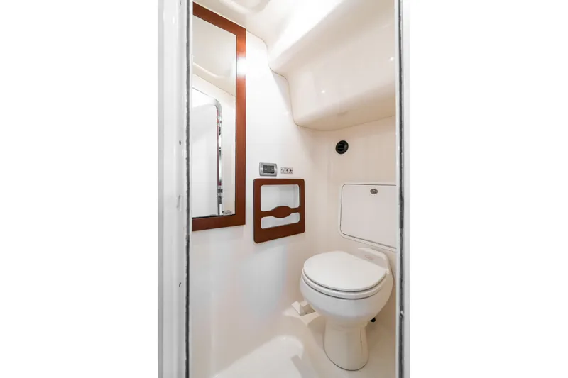 Slide: The Image of 2005 Sea Ray 390 Motor Yacht bathroom with modern fixtures and sleek design. - 39