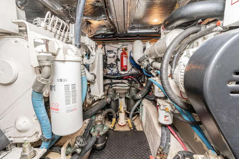 Slide: The Image of Engine room of 2005 Sea Ray 390 Motor Yacht, showcasing mechanical components and systems. - 41