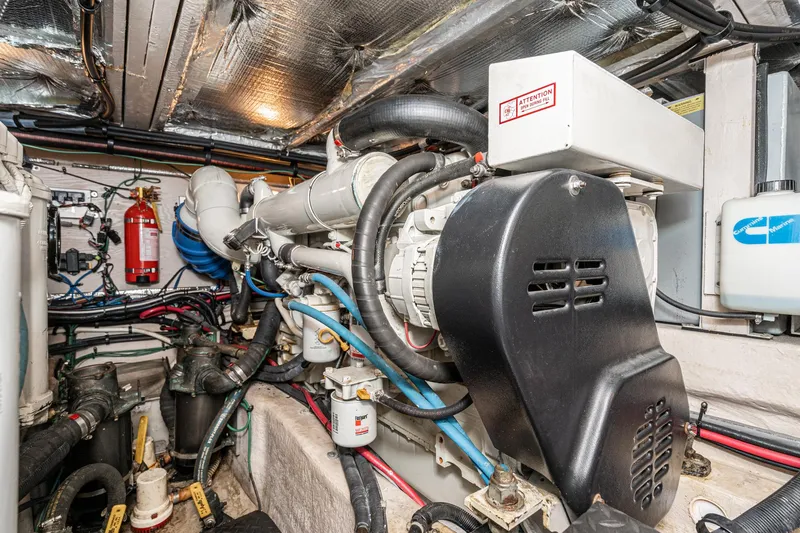 Slide: The Image of Engine room of 2005 Sea Ray 390 Motor Yacht with visible machinery and wiring. - 42