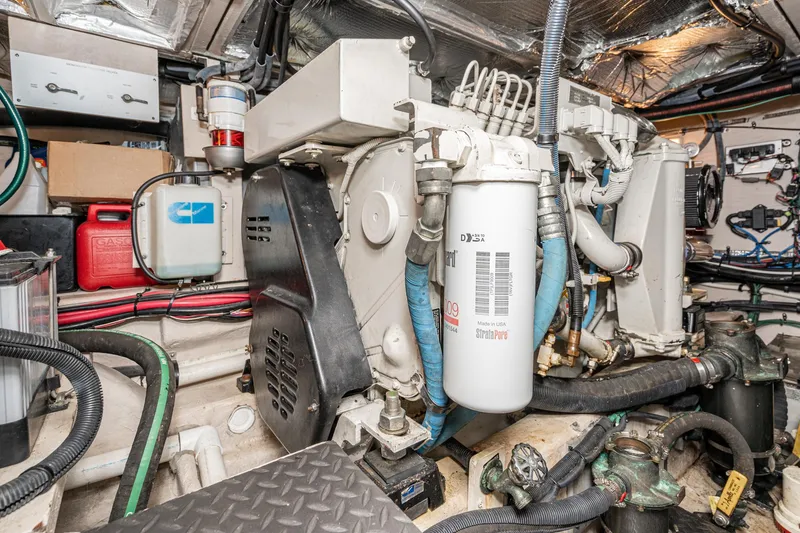 Slide: The Image of Engine room of a 2005 Sea Ray 390 Motor Yacht, showcasing mechanical components. - 43