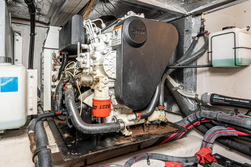 Slide: The Image of Engine room of 2005 Sea Ray 390 Motor Yacht with Onan generator and wiring. - 44