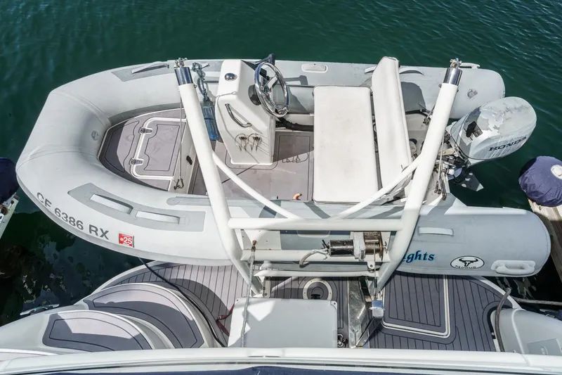 Slide: The Image of 2005 Sea Ray 390 Motor Yacht with inflatable dinghy and Honda outboard motor. - 45