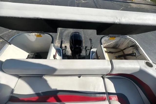 Slide: The Image of Sweetwater 2019 EL boat interior with seating and motor, year 2000 model. - 11