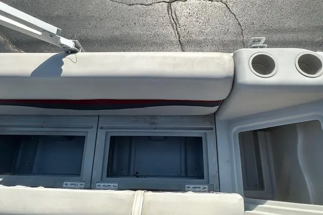 Slide: The Image of Sweetwater 2019 EL boat interior with storage compartments and cup holders, 2000 model. - 9