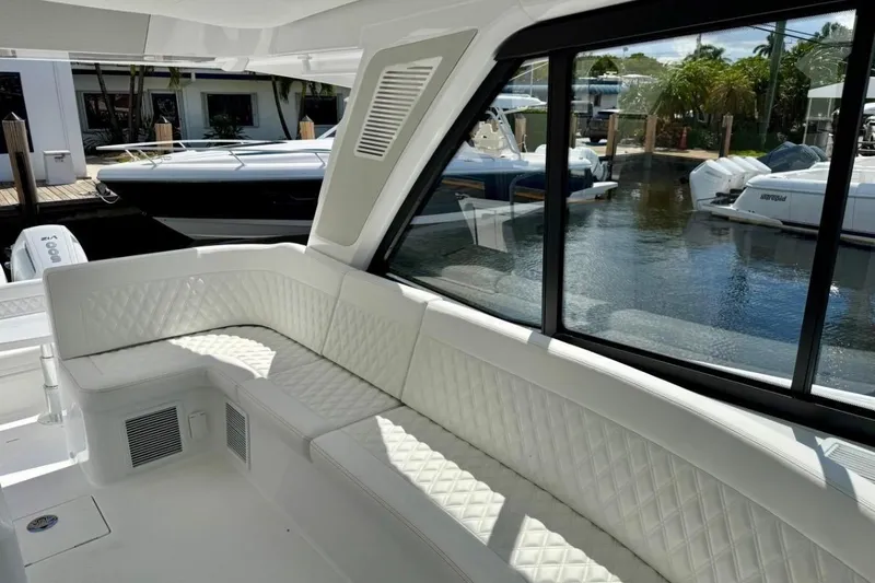 Slide: The Image of Luxurious interior of 2026 Intrepid 50 yacht with white quilted seating. - 10