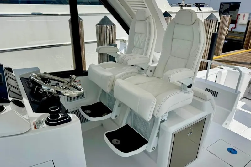 Slide: The Image of Luxury helm seats on 2026 Intrepid 50 yacht, featuring sleek design and modern controls. - 4