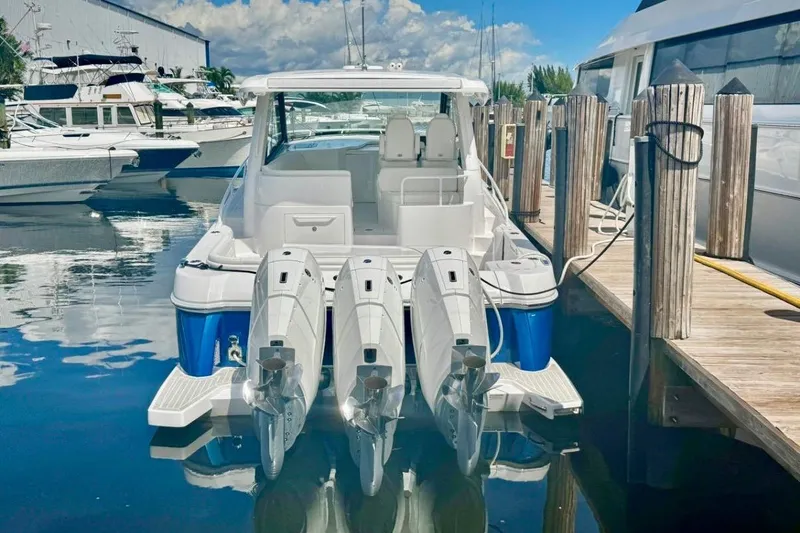 Slide: The Image of 2026 Intrepid 50 boat docked with four powerful outboard engines. - 5