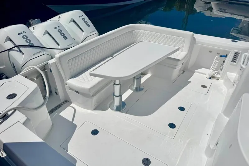 Slide: The Image of Luxurious seating area on 2026 Intrepid 50 boat with modern outboard engines. - 8