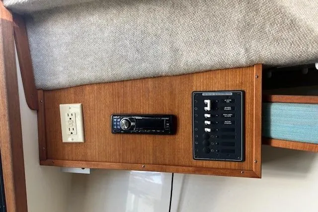 Slide: The Image of 2001 Carolina Classic 25 Classic boat interior with control panel and stereo system. - 10