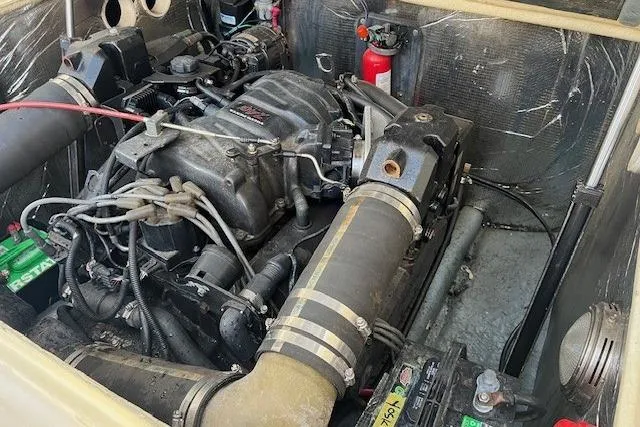 Slide: The Image of Engine compartment of a 2001 Carolina Classic 25 Classic boat, featuring visible components. - 11