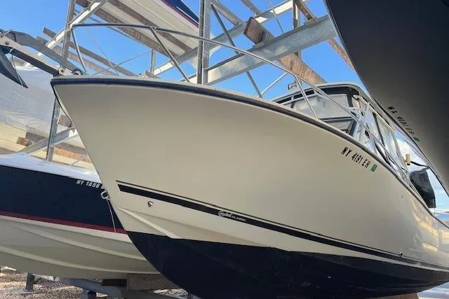 Slide: The Image of 2001 Carolina Classic 25 Classic boat in storage, side view. - 4