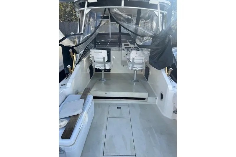 Slide: The Image of 2001 Carolina Classic 25 Classic boat interior with seating and controls. - 5
