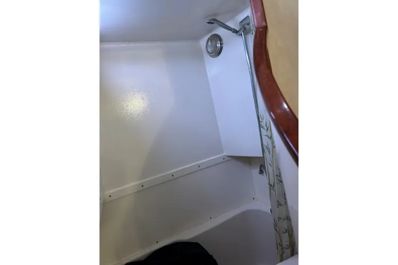 Slide: The Image of Shower area in 2001 Crosswater Passagemaker 49 boat, featuring a handheld showerhead. - 20
