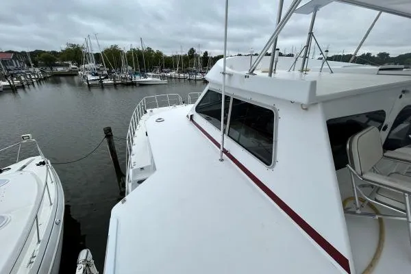 Slide: The Image of 2001 Crosswater Passagemaker 49 yacht docked at marina, overcast sky. - 29