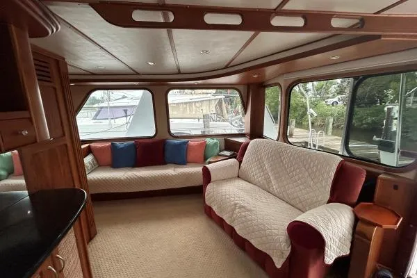 Slide: The Image of Luxurious interior of 2001 Crosswater Passagemaker 49 yacht with plush seating and large windows. - 3