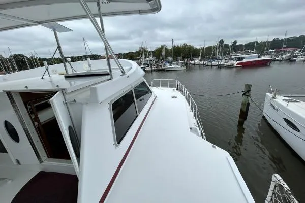 Slide: The Image of 2001 Crosswater Passagemaker 49 yacht docked at marina, overcast sky. - 30